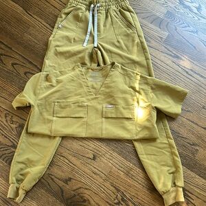 Olive green Fig scrubs. Top is XSmall, pants XXS. Jogger type bottoms